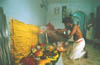 The Itumban puja performed at a devotee�s home, marking the end of the festival