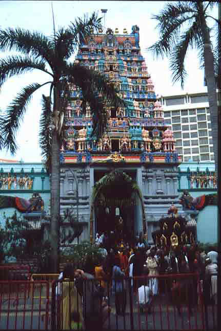 Devotees carrying their kavadis arriving at the Thandayudhapani temple, Tank Road